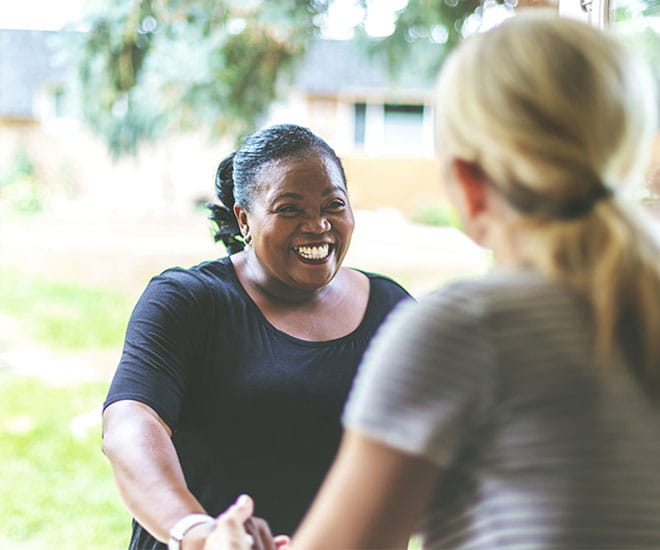 woman helping next door neighbor